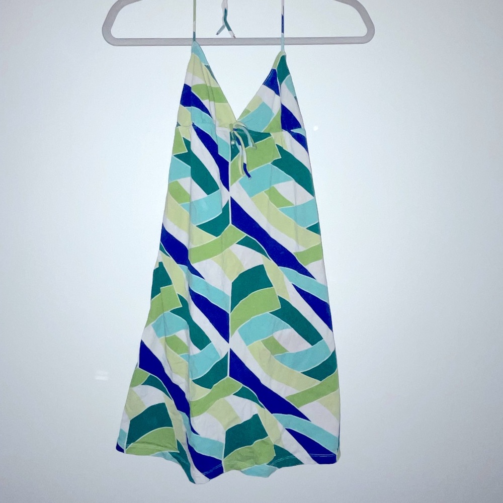 Dress has been sewed in the back to fit slightly smaller. Halter dress. S or XS